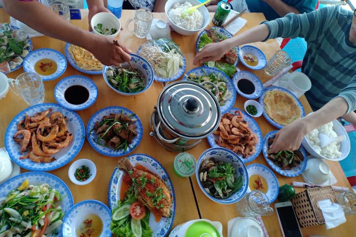 Tourists have lunch at the fishing village restaurant
