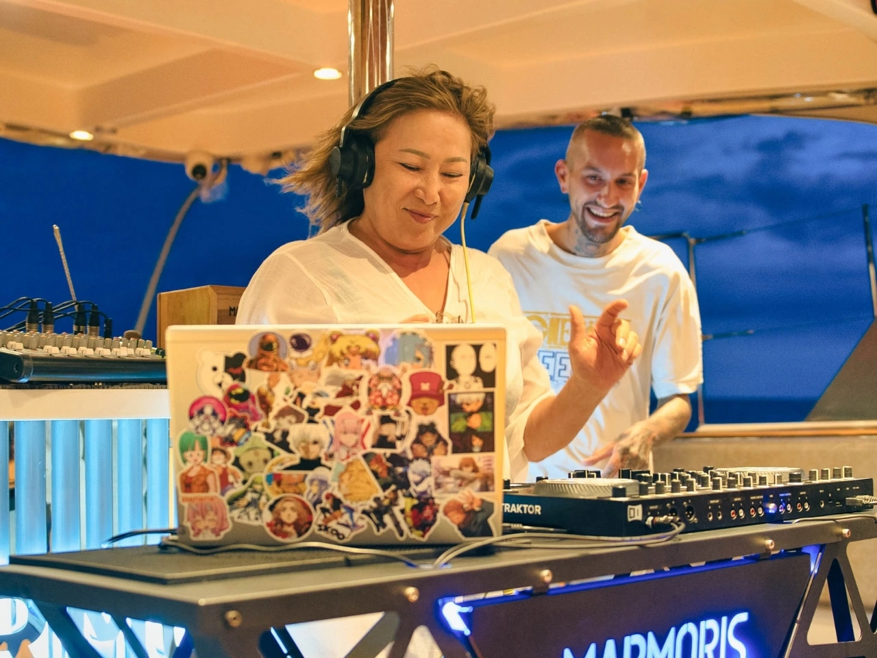 Vibrant DJ party aboard Marmoris Sunset Cruise.