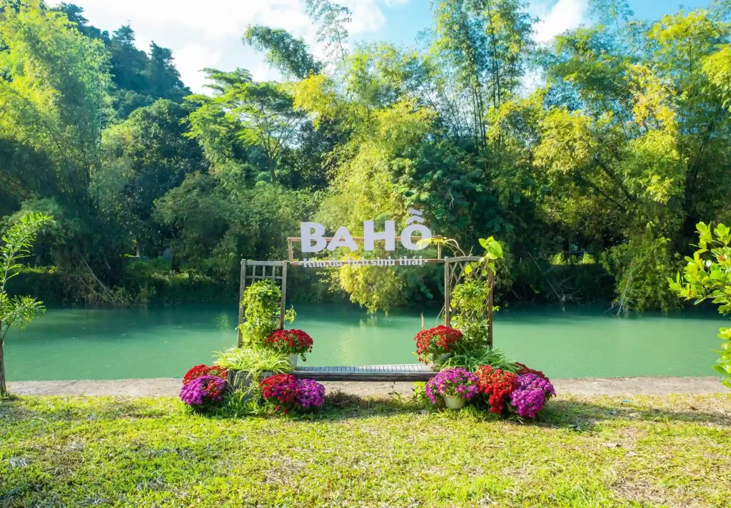 Panoramic view of Ba Ho Waterfalls Eco-Tourism Park surrounded by lush primary rainforest and rocky stream cascades