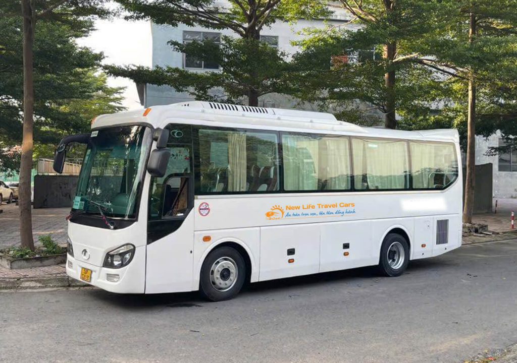 Modern 29-seater passenger coach ready for 2-day 1-night group tour across Nha Trang and coastal destinations