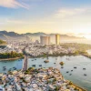 Panoramic bird's-eye view of Nha Trang coastal bay and city skyline visited during private car charter