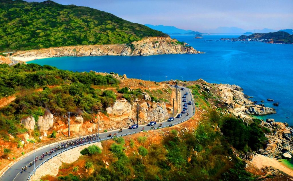 Winding scenic coastal pass Road 702 traversing Nui Chua National Park towards Vinh Hy Bay