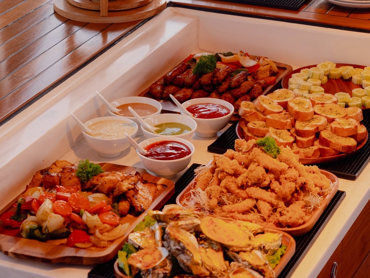 Gourmet seafood BBQ buffet aboard Marmoris Catamaran.